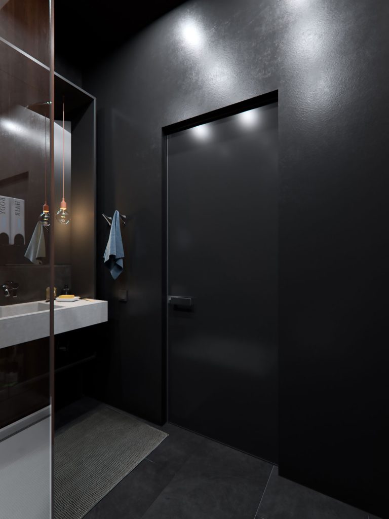 Strakke zwarte deur en donkere wandtegels in moderne badkamer