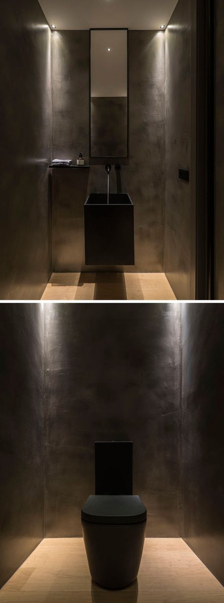 minimalistisch toilet met zwarte muren