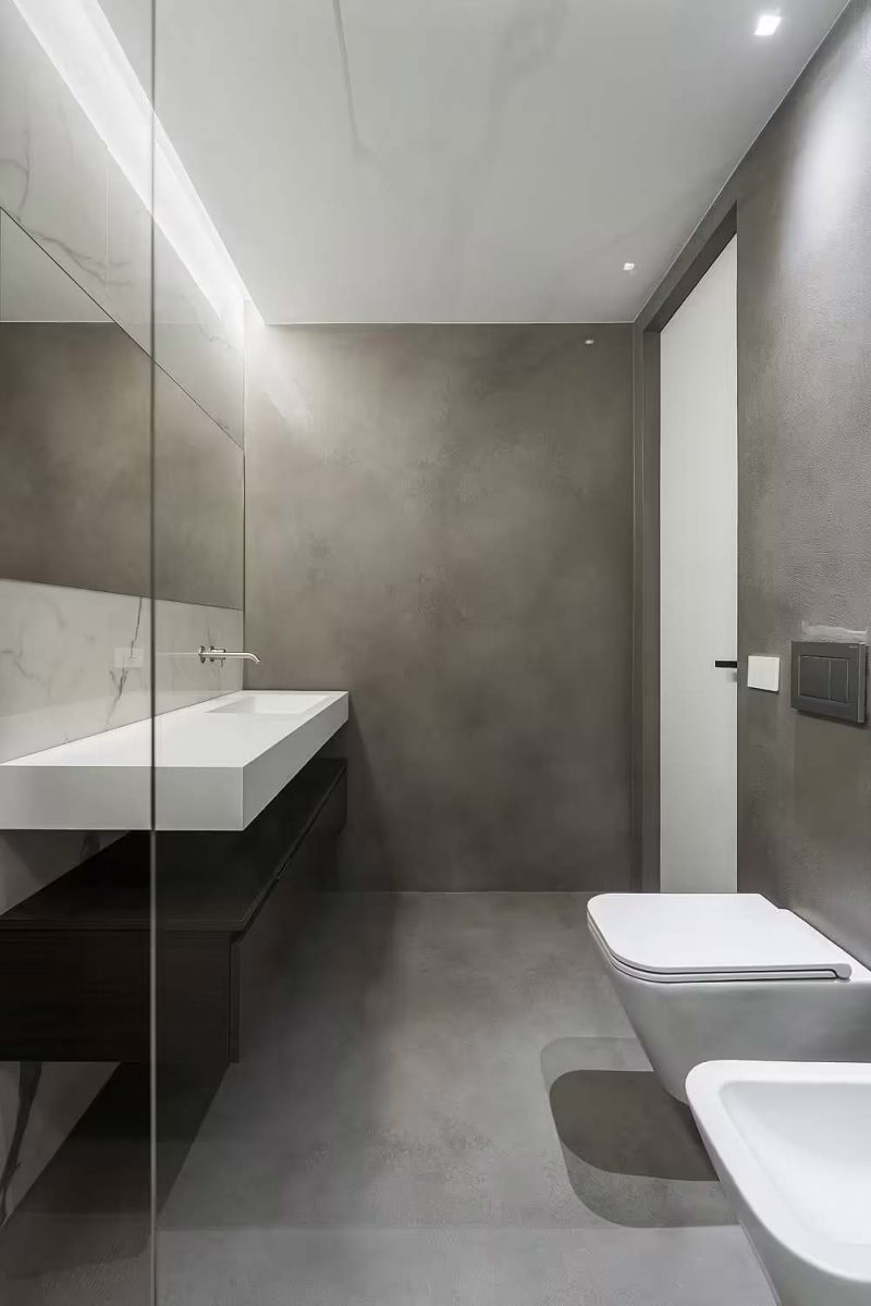 stoere badkamer betonlook muren marmer